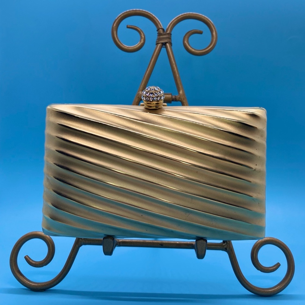 Vintage Sasha gold formal metal evening bag with jeweled closure.